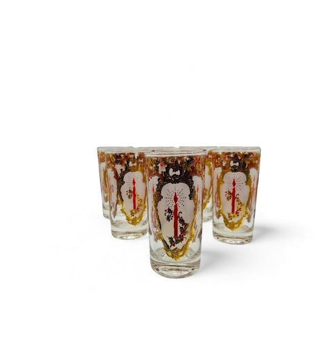 Hinson Vintage Interiors set of eight Culver Christmas drinking glasses with gold trim, holly, and red candle motifs.