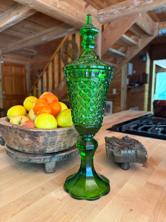 Why Vintage Glass Feels Different From Modern Glass. Image of vibrant kelly green vintage apothecary jar