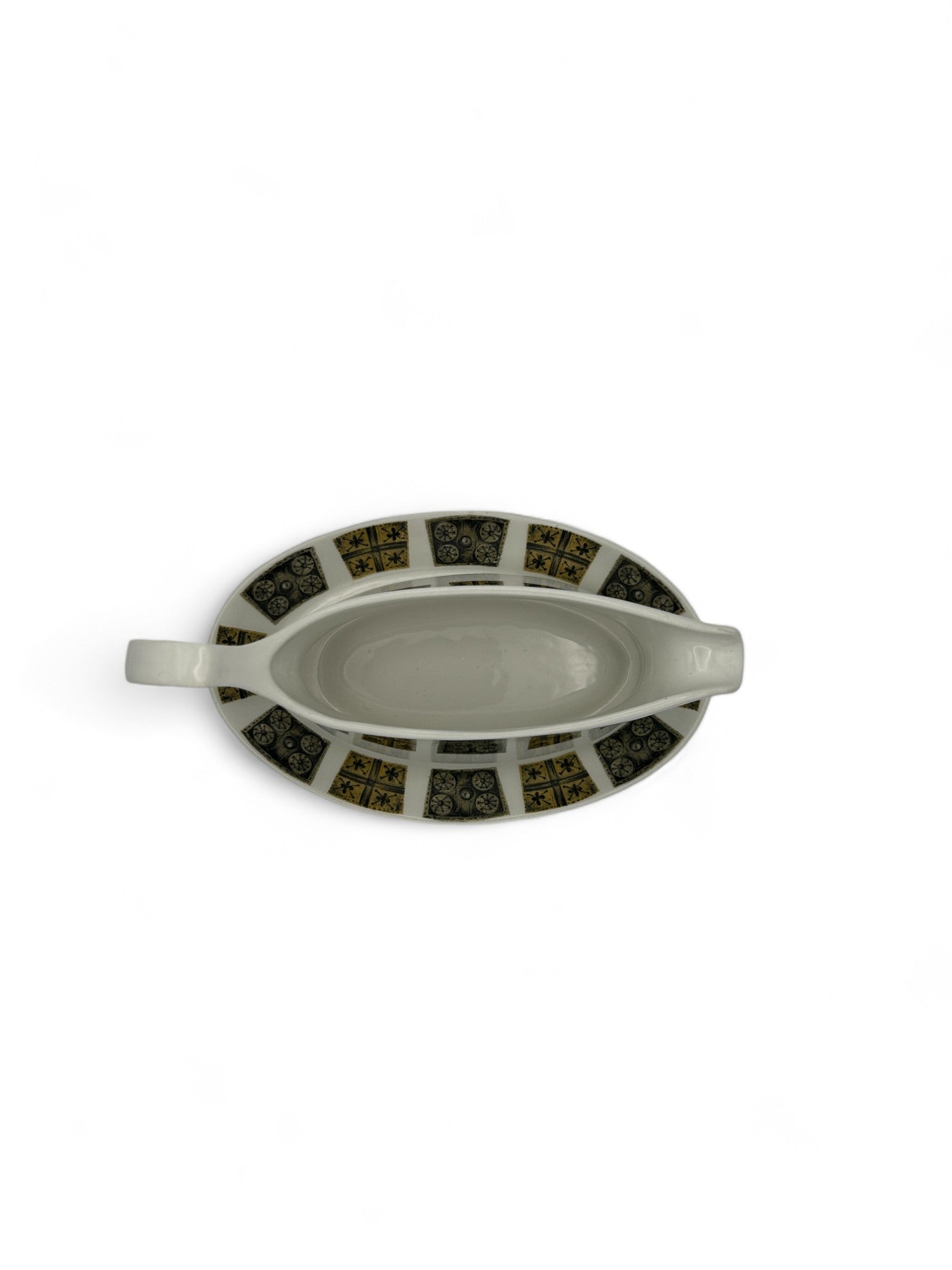 Complete your dining table with this elegant mid-century modern gravy boat and matching underplate.