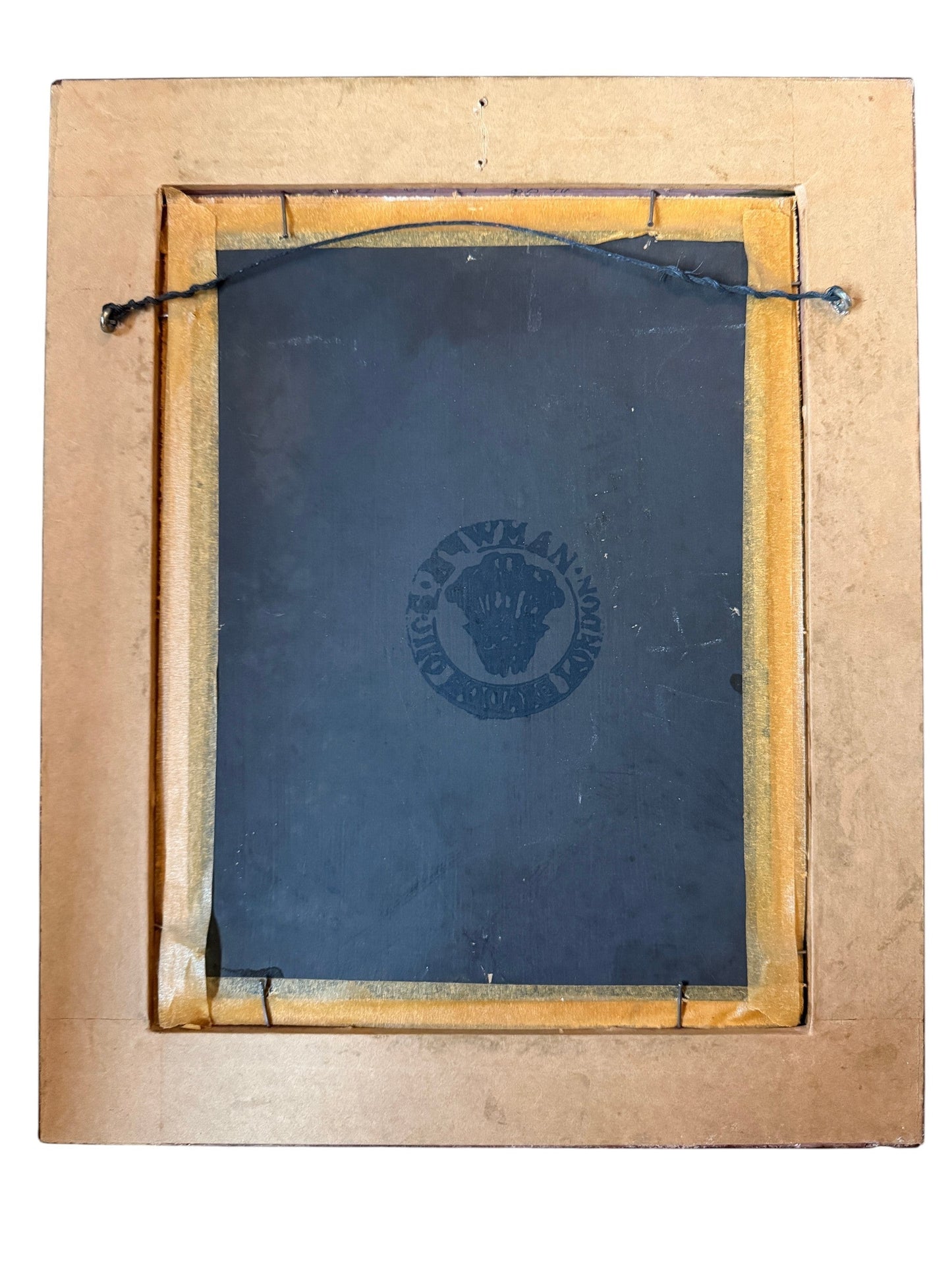 Back view of an antique portrait frame from Hinson Vintage Interiors with a black backing and original wire hanger.
