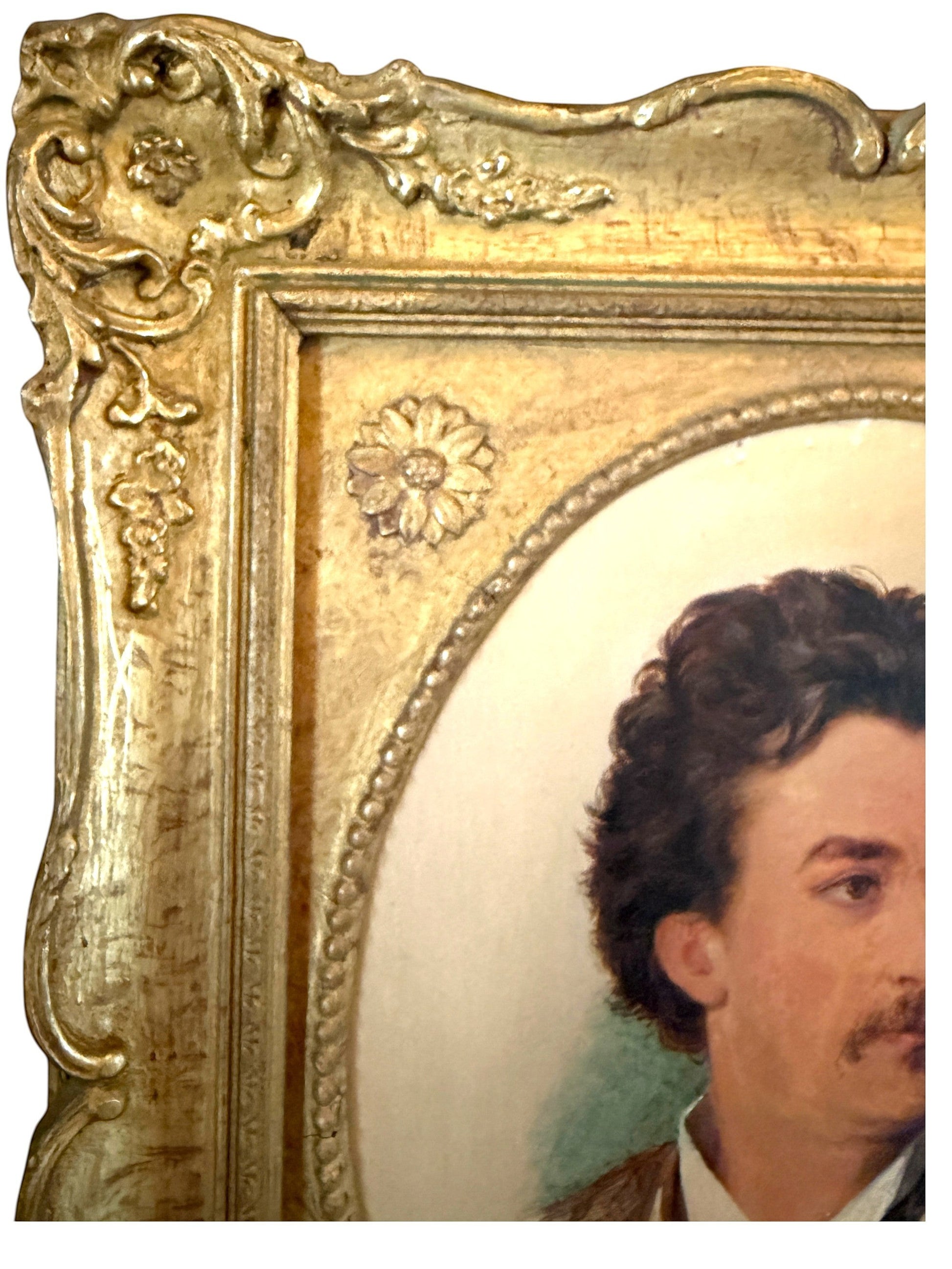 Hinson Vintage Interiors antique oval portrait painting of a man in an ornate gold floral frame from 1874