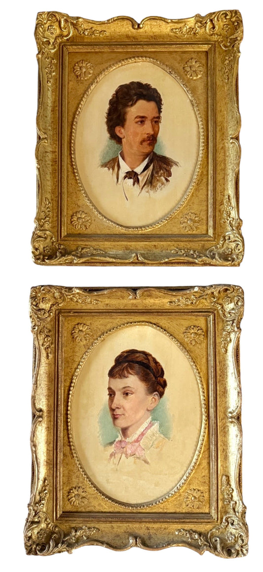 Hinson Vintage Interiors pair of 1874 oval portrait paintings of a man and woman in ornate gold-toned floral frames.