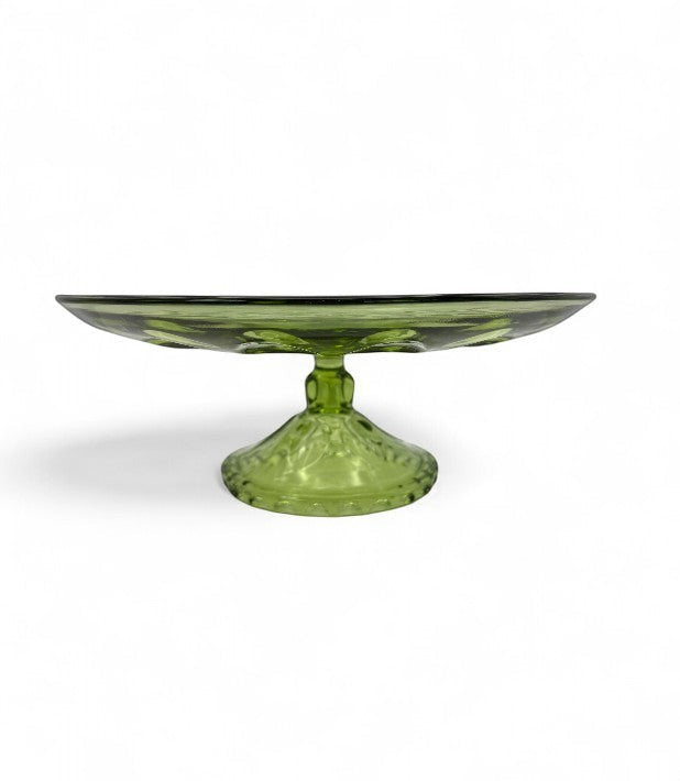 Hinson Vintage Interiors 1960s Hazel Atlas avocado green pressed glass pedestal cake plate with thumbprint design.