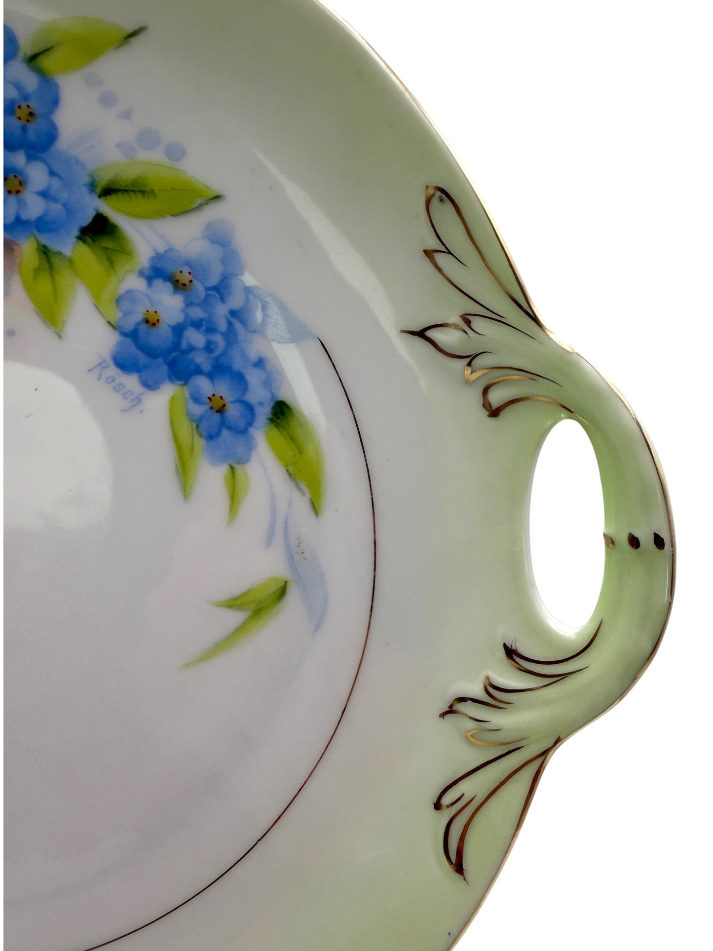 Hinson Vintage Interiors Bavaria Rosch porcelain cake plate with blue floral pattern, gold trim, and side handles.