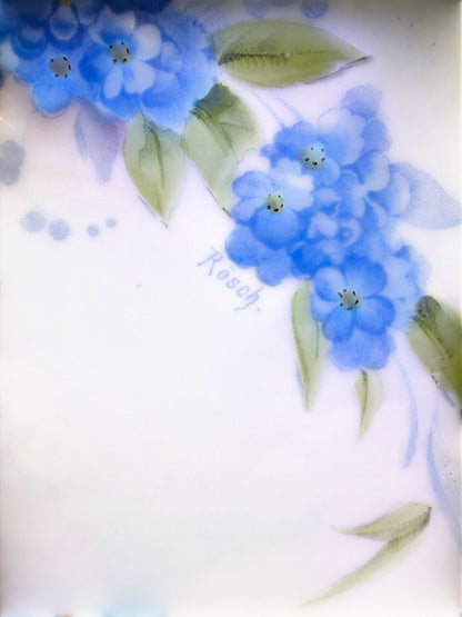 Hinson Vintage Interiors Bavaria Rosch porcelain cake plate featuring hand-painted blue floral sprays and green leaves.
