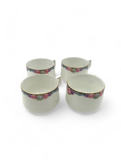 Hinson Vintage Interiors set of four white porcelain Bavarian tea cups with floral patterns and gold trim.