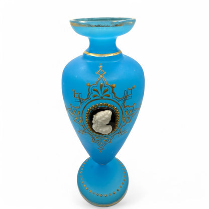 Hinson Vintage Interiors blue opaline glass vase featuring an applied white cameo portrait and intricate gold trim.