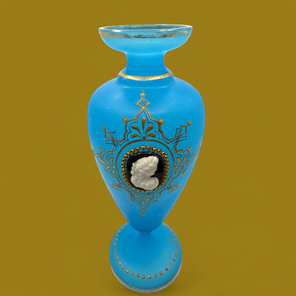 Hinson Vintage Interiors blue opaline glass vase featuring an applied white cameo portrait and gold painted details.