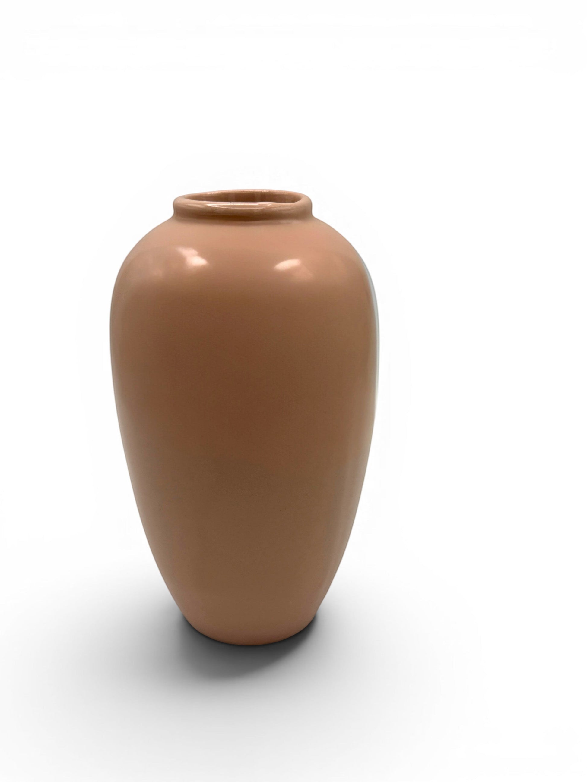 Hinson Vintage Interiors blush pink Hull Pottery vase with a smooth glazed ceramic finish on a white background.