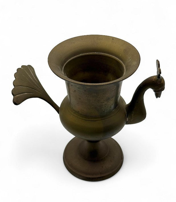 Hinson Vintage Interiors vintage brass vase from India featuring a sculpted peacock handle and fan-shaped tail.