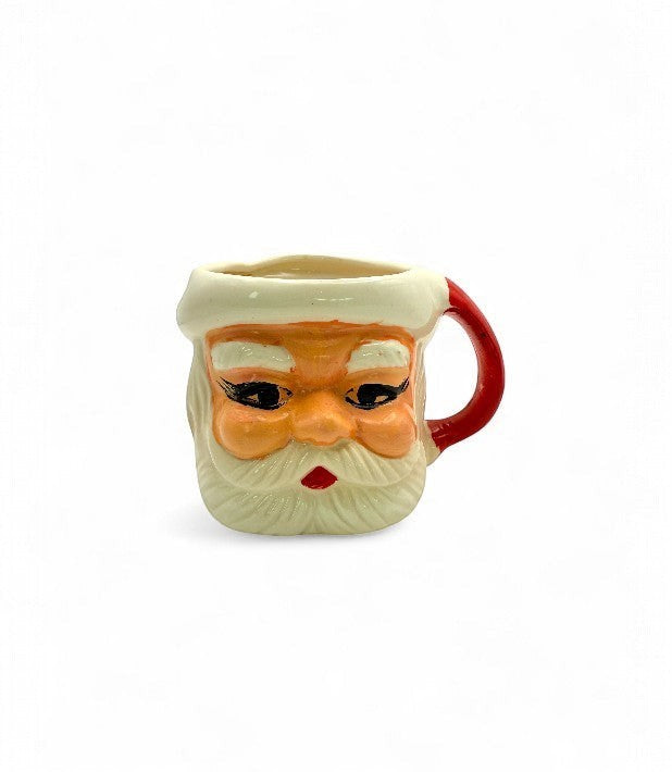 Hinson Vintage Interiors hand-painted ceramic Santa Claus mug with a red handle, 1950s Japanese Christmas collectible.