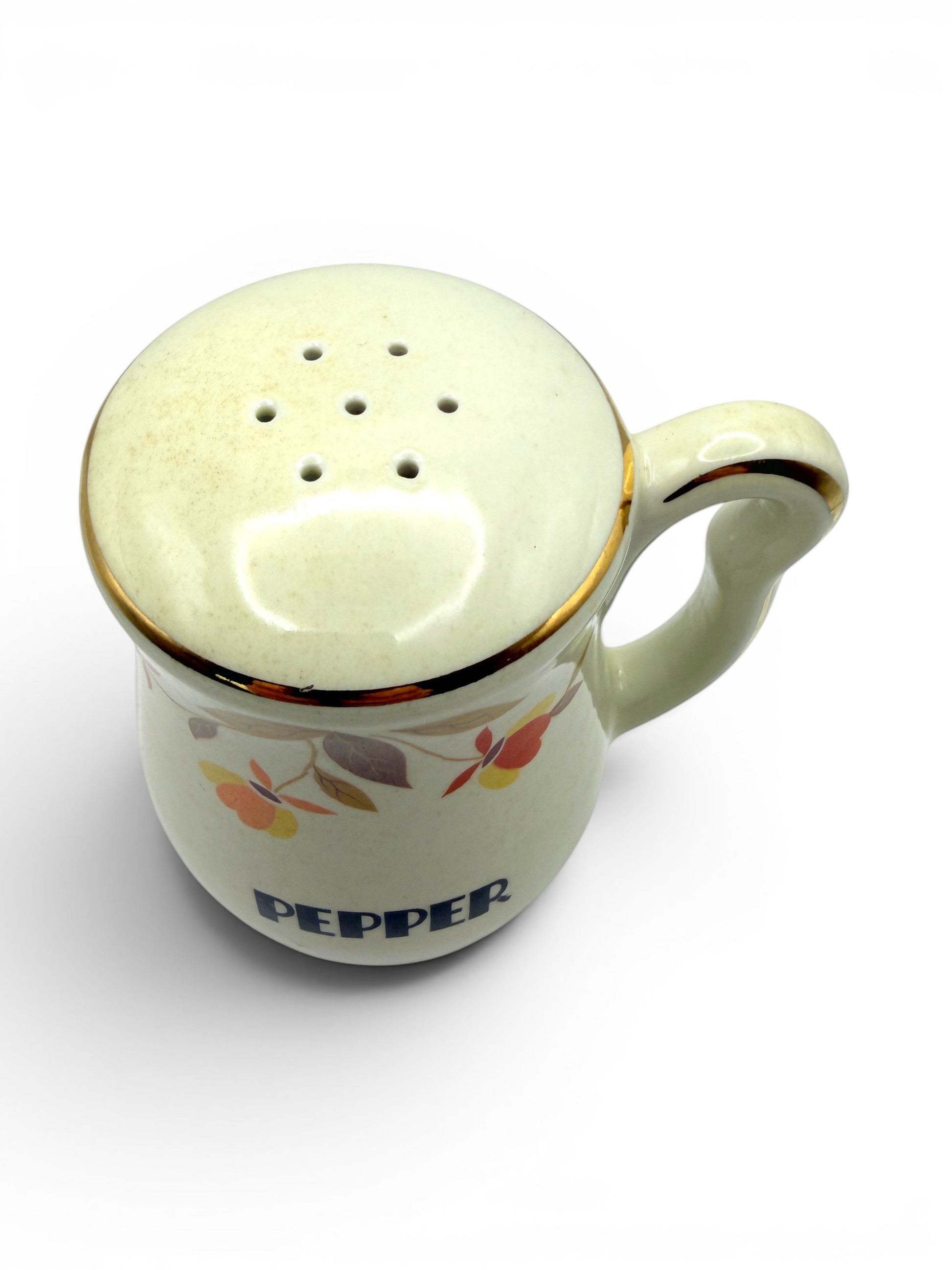 Hinson Vintage Interiors Hall China Autumn Leaf ceramic pepper shaker with gold trim and colorful leaf pattern