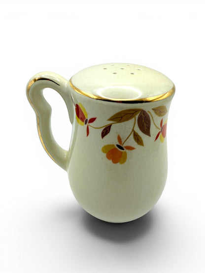 Hinson Vintage Interiors Hall China Autumn Leaf ceramic salt and pepper shaker with gold trim and floral pattern.