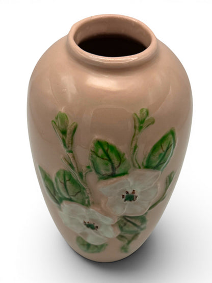 Hinson Vintage Interiors Hull Pottery vase in blush pink with raised white floral and green leaf relief design.