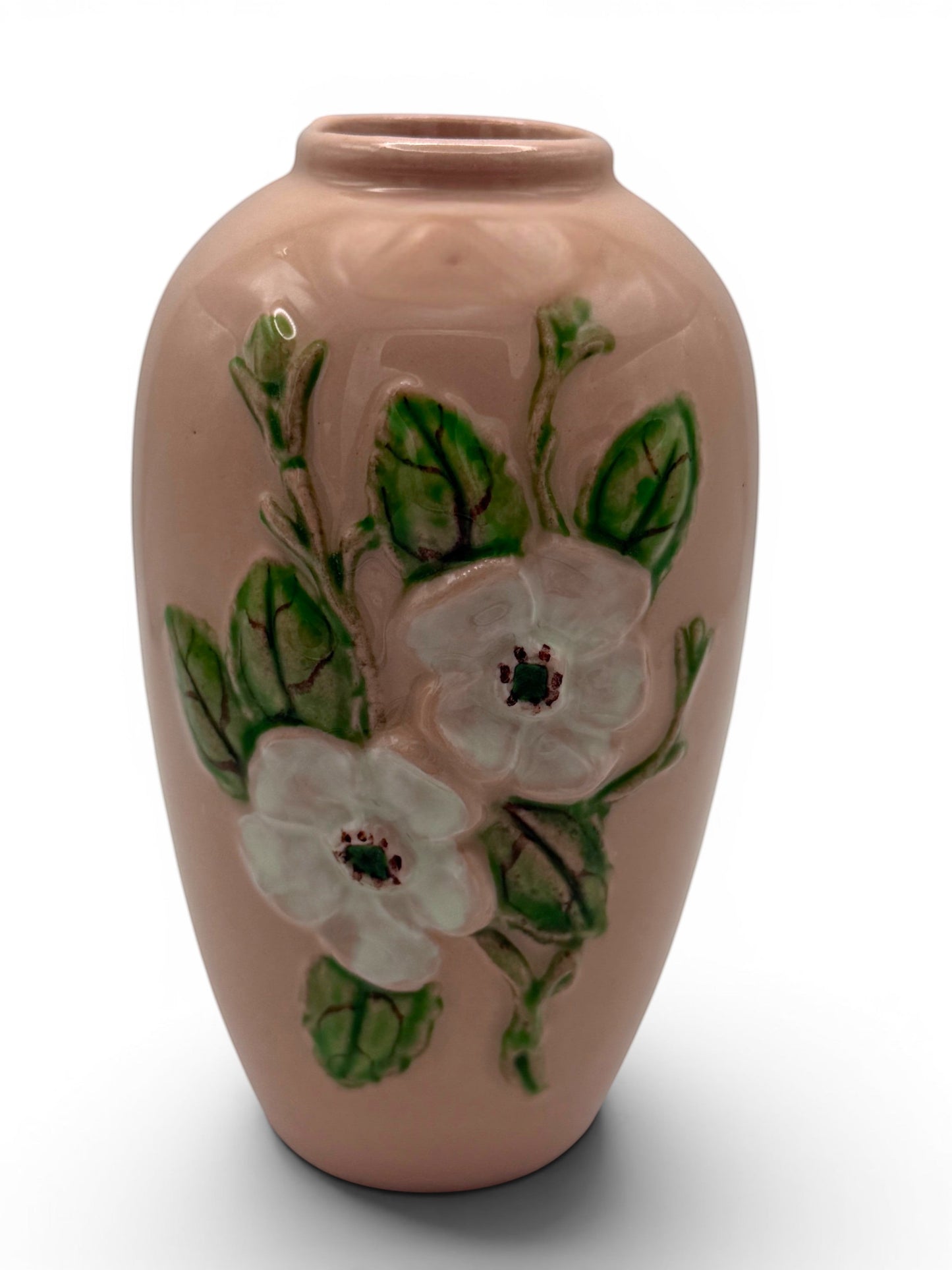 Hinson Vintage Interiors Hull Pottery vase in blush pink with raised white floral and green leaf relief design