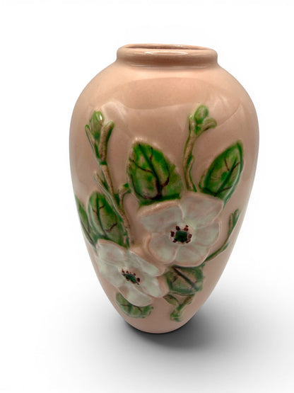 Hinson Vintage Interiors Hull Pottery vase in blush pink with raised white floral and green leaf relief design