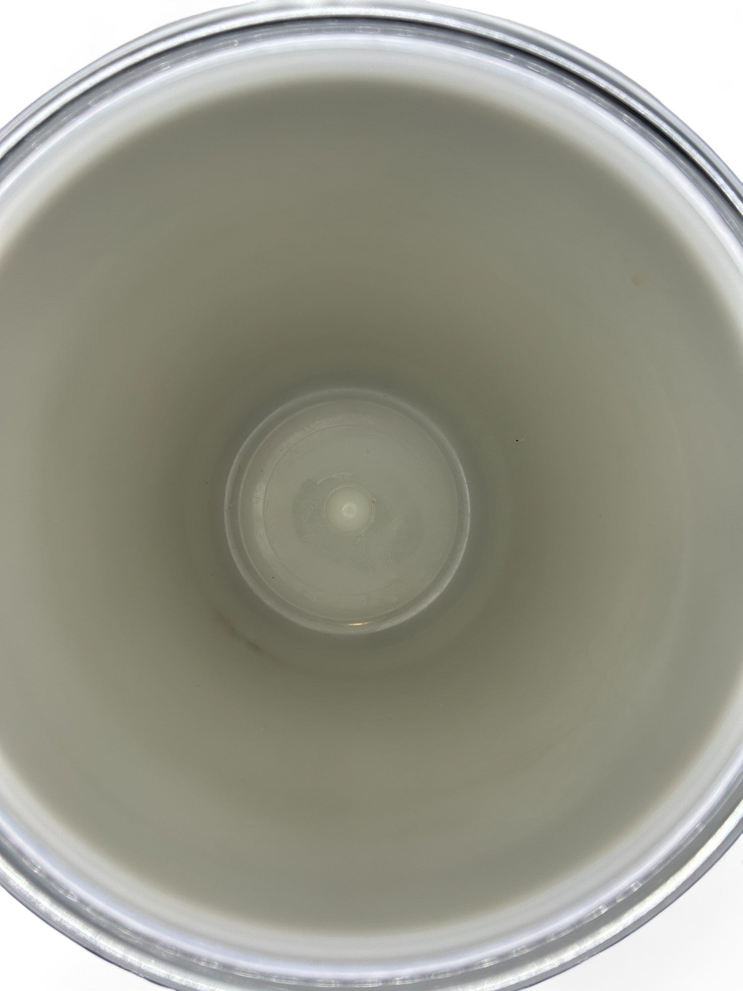 Interior view of a Hinson Vintage Interiors mid-century Kromex ice bucket showing the clean white insulated basin