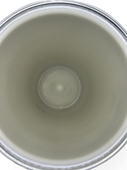 Interior view of a Hinson Vintage Interiors mid-century Kromex ice bucket showing the clean white insulated basin