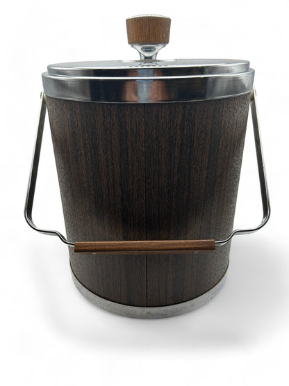 Hinson Vintage Interiors mid-century Kromex ice bucket with faux wood finish, chrome accents, and a sturdy handle.