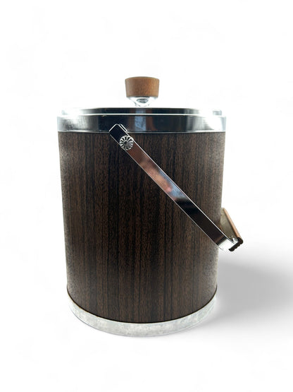Hinson Vintage Interiors mid-century Kromex ice bucket with faux wood finish, chrome accents, and a sturdy handle.
