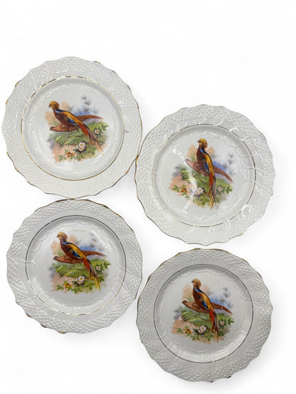 Hinson Vintage Interiors set of four antique Moulin des Loups French faience dessert plates with game bird motifs.
