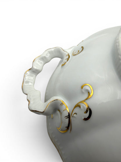 Hinson Vintage Interiors white porcelain serving bowl with ornate gold trim and scalloped handle detail