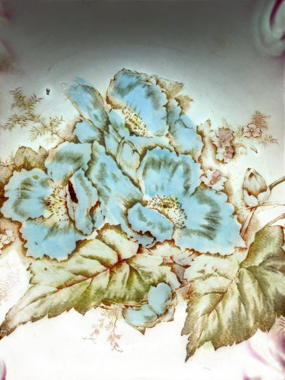 Hinson Vintage Interiors antique La Francaise porcelain bowl featuring a detailed blue floral center and pink shading.
