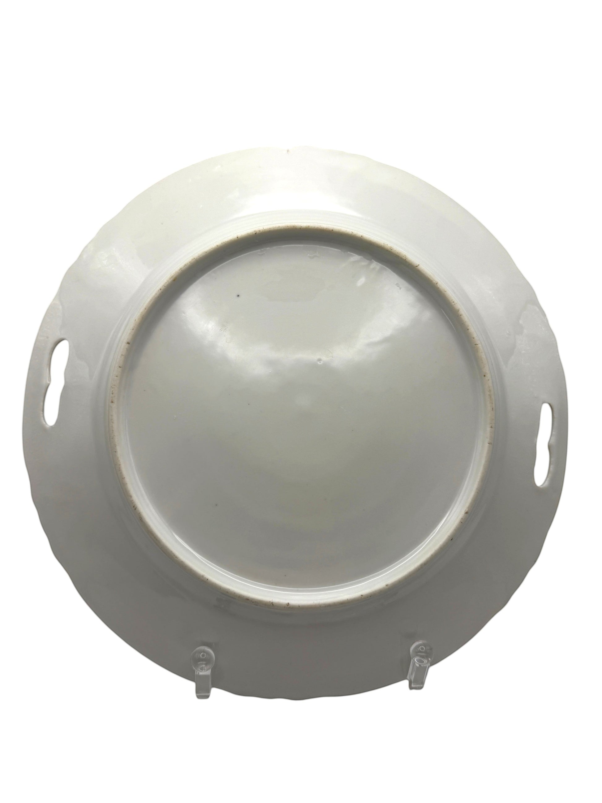 Hinson Vintage Interiors porcelain cake plate underside showing the smooth white base and integrated side handles.