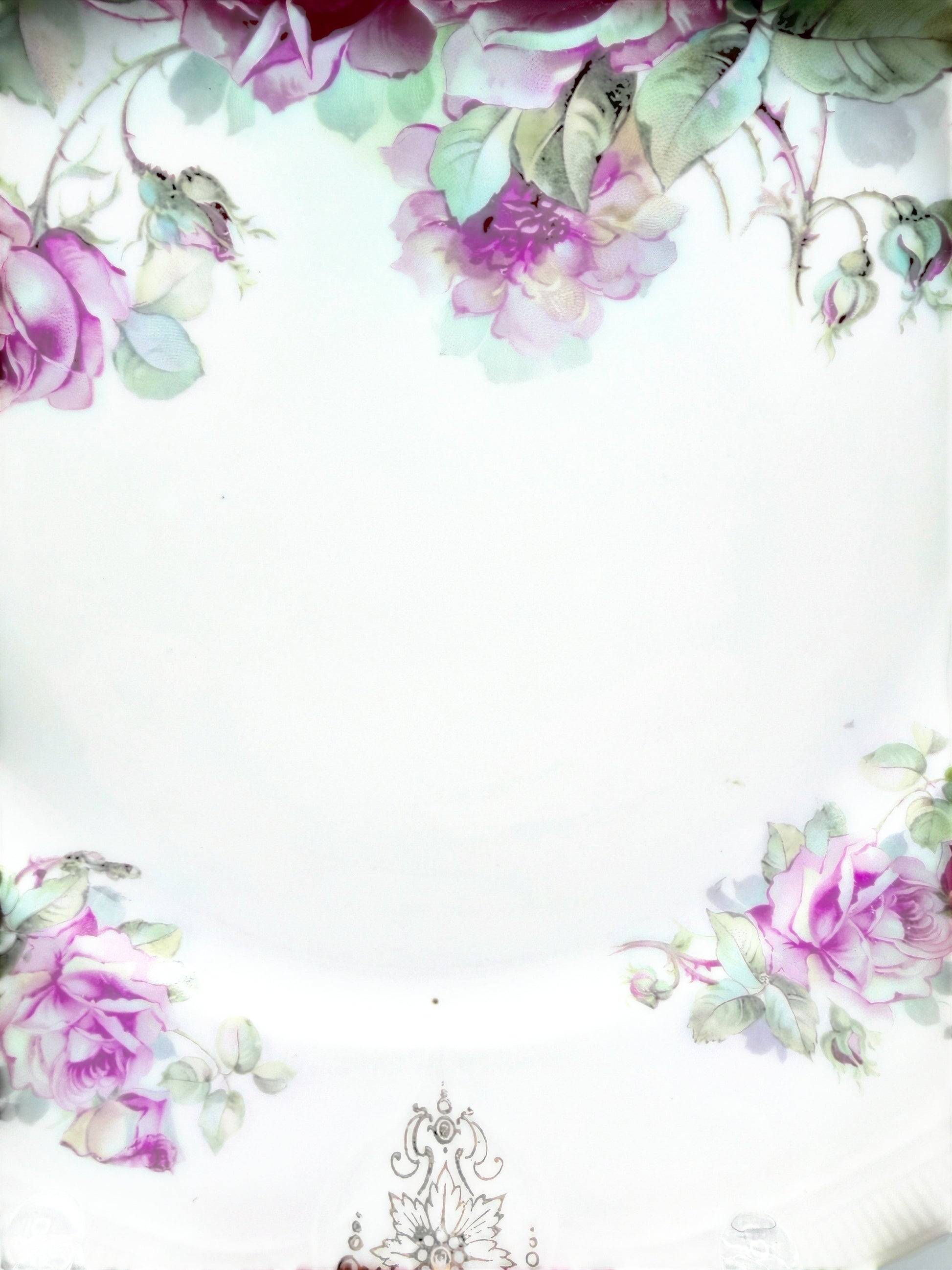 Hinson Vintage Interiors porcelain cake plate with pink roses, green leaves, and black and gold scroll accents.