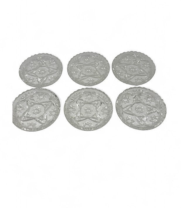 Hinson Vintage Interiors set of six clear pressed glass coasters with a vintage starburst and floral pattern.