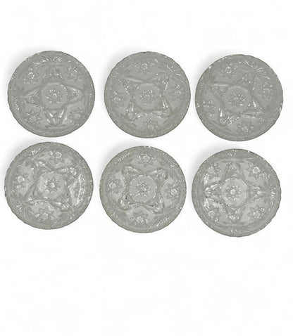 Hinson Vintage Interiors set of six clear pressed glass coasters with a vintage starburst and floral pattern.
