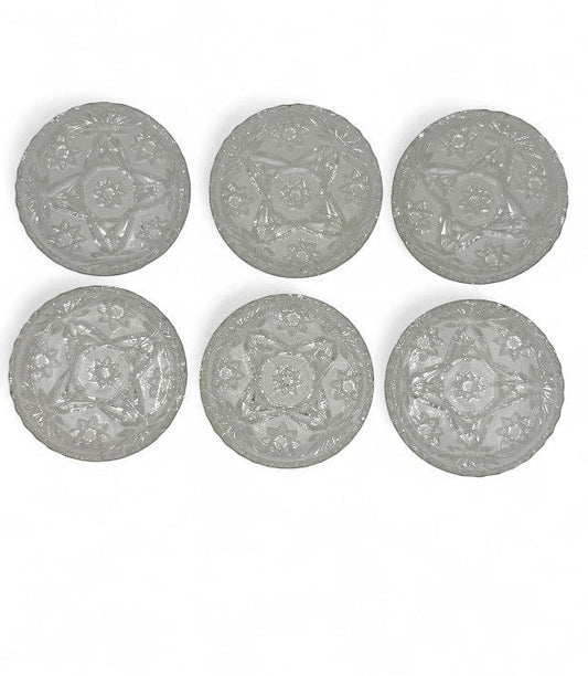 Hinson Vintage Interiors set of six clear pressed glass coasters with a vintage starburst and floral pattern.