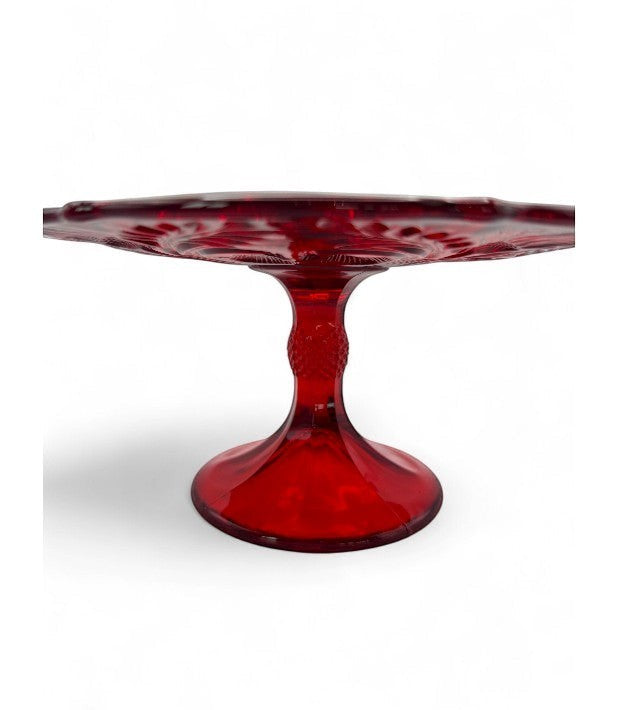 Hinson Vintage Interiors ruby red pressed glass cake stand with Inverted Thistle pattern and pedestal base.
