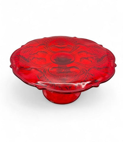Hinson Vintage Interiors ruby red pressed glass cake stand with Inverted Thistle floral pattern and pedestal base.