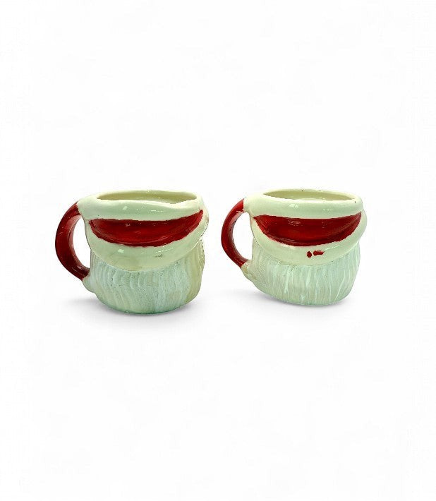 Hinson Vintage Interiors set of two hand-painted ceramic Santa Claus mugs with red handles from the 1950s.