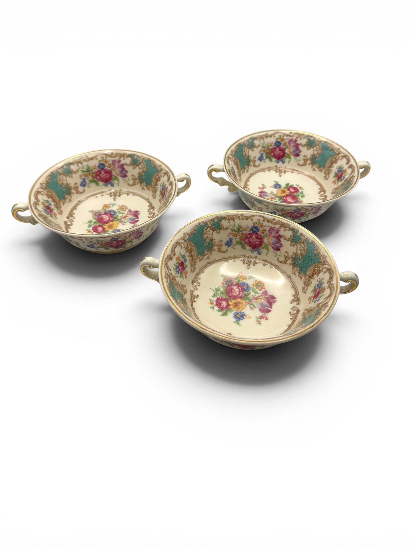 Hinson Vintage Interiors set of three Syracuse China Romance Green cream soup bowls with floral patterns and gold trim.
