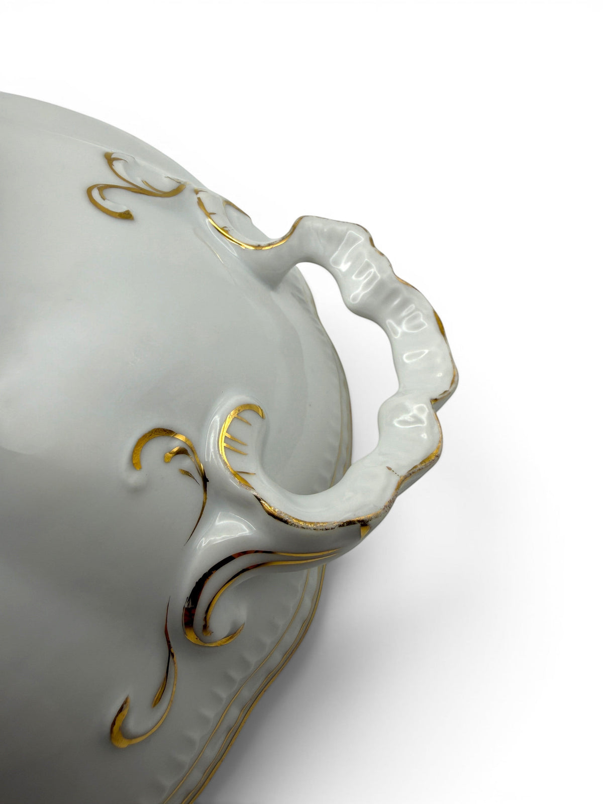 Hinson Vintage Interiors white porcelain serving bowl with ornate gold trim and scalloped handles